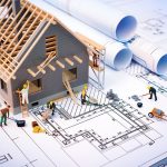 building house on blueprints with worker – construction project